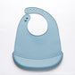 Bavoir bébé en silicone bleu à poche récupératrice