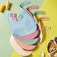 Bavoirs bébé en silicone de plusieurs couleurs avec poche récupératrice